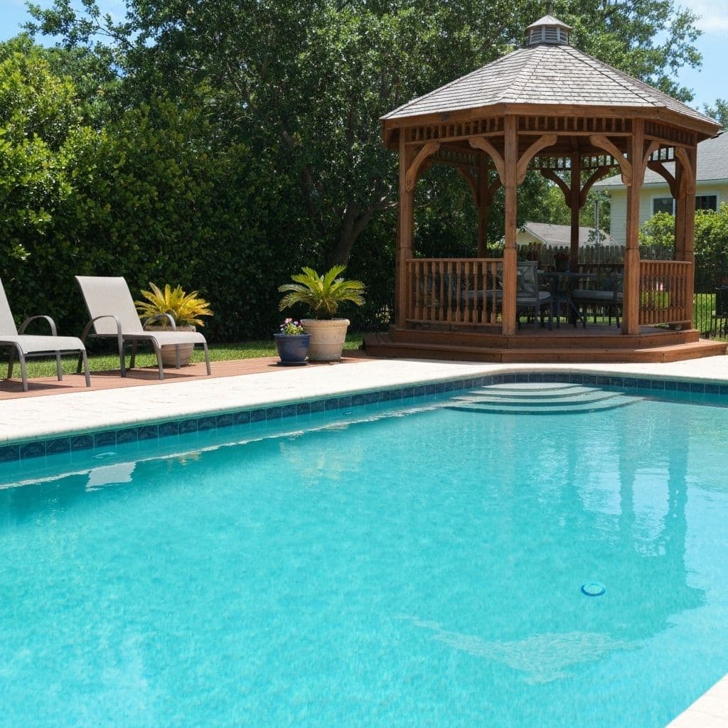 Clean pool with gazebo patio area after professional service