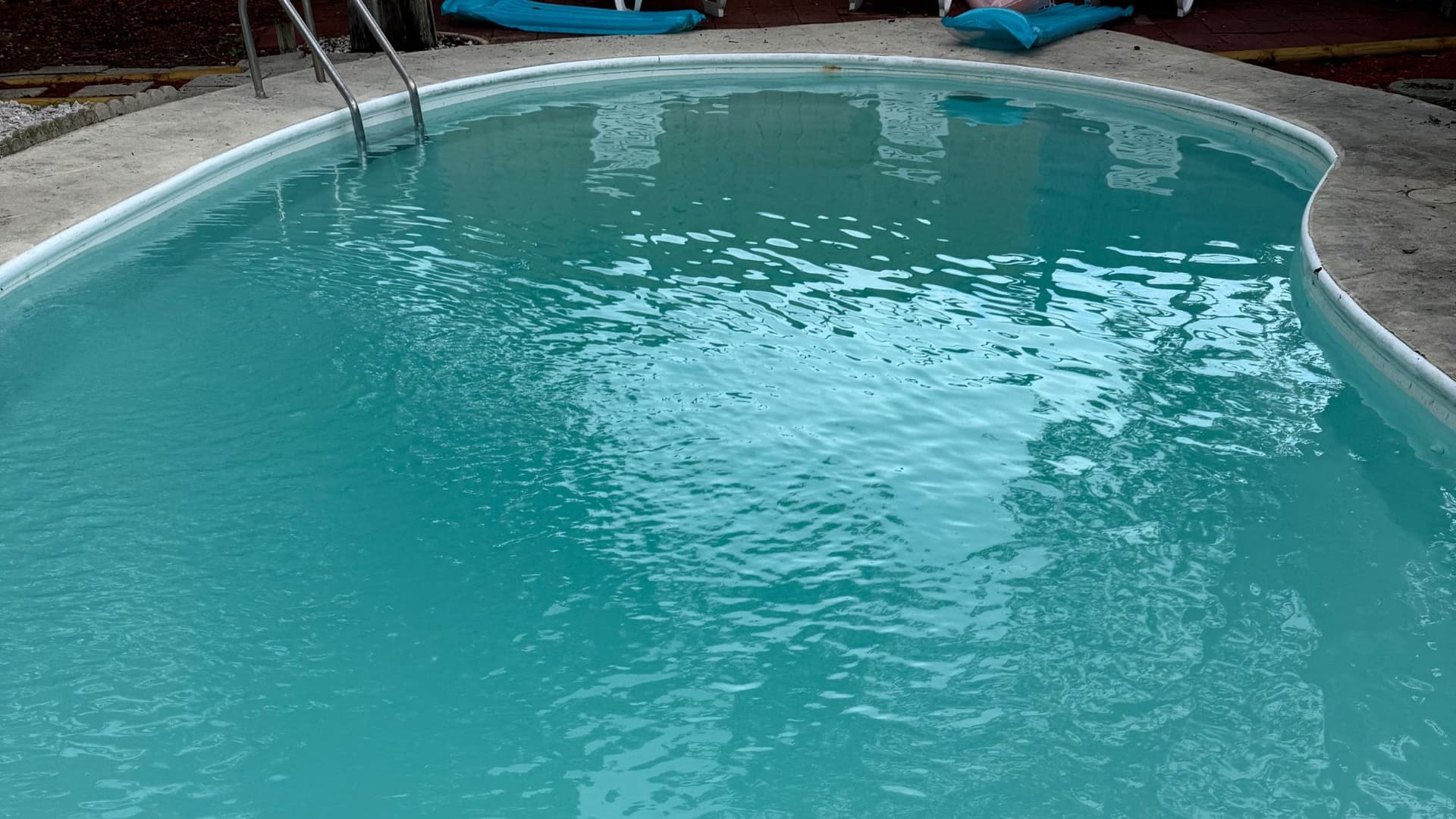 Close-up of crystal clear pool water showing pristine water quality