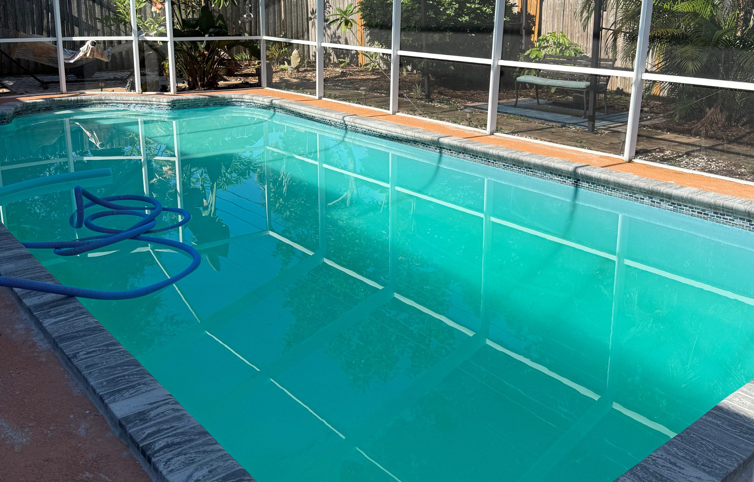 Pool maintenance in progress with professional equipment