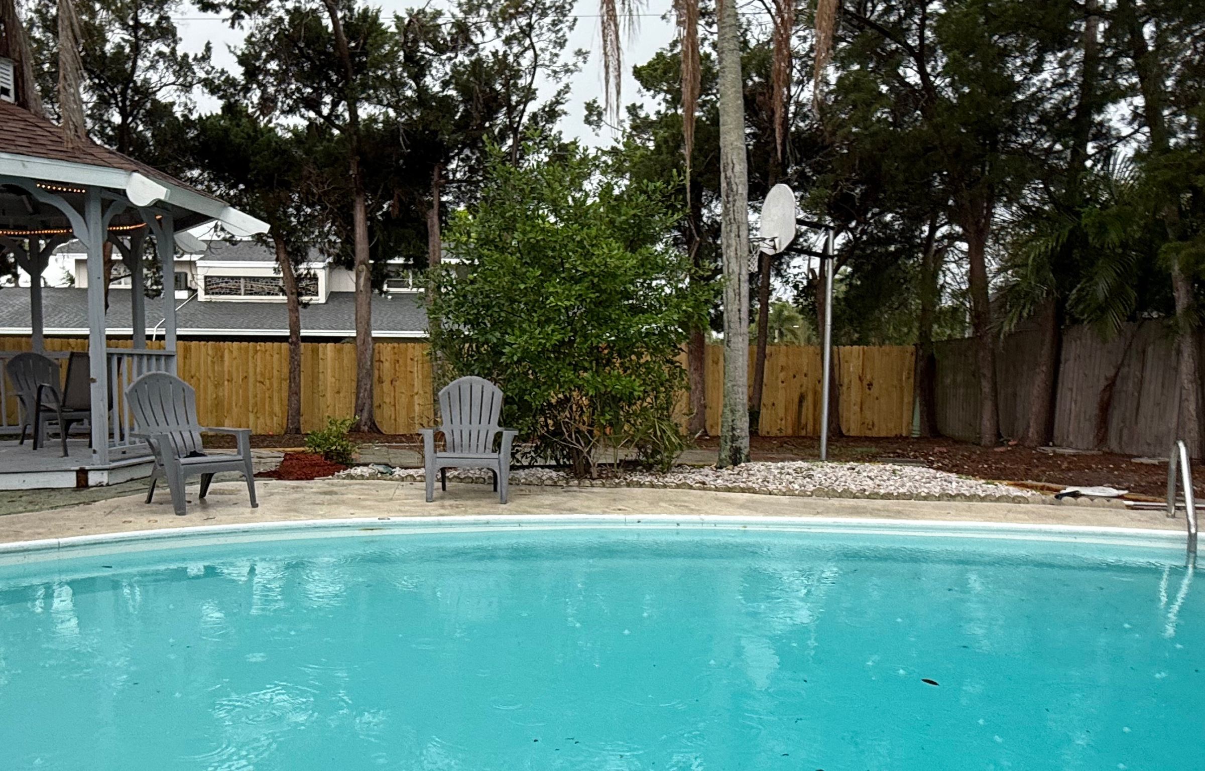 Clean pool with gazebo patio area after professional service